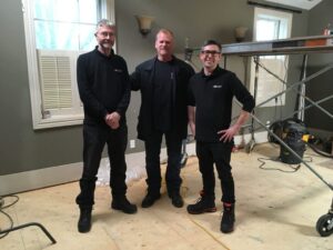 Our chimney technicians standing with celebrity contractor, Mike Holmes